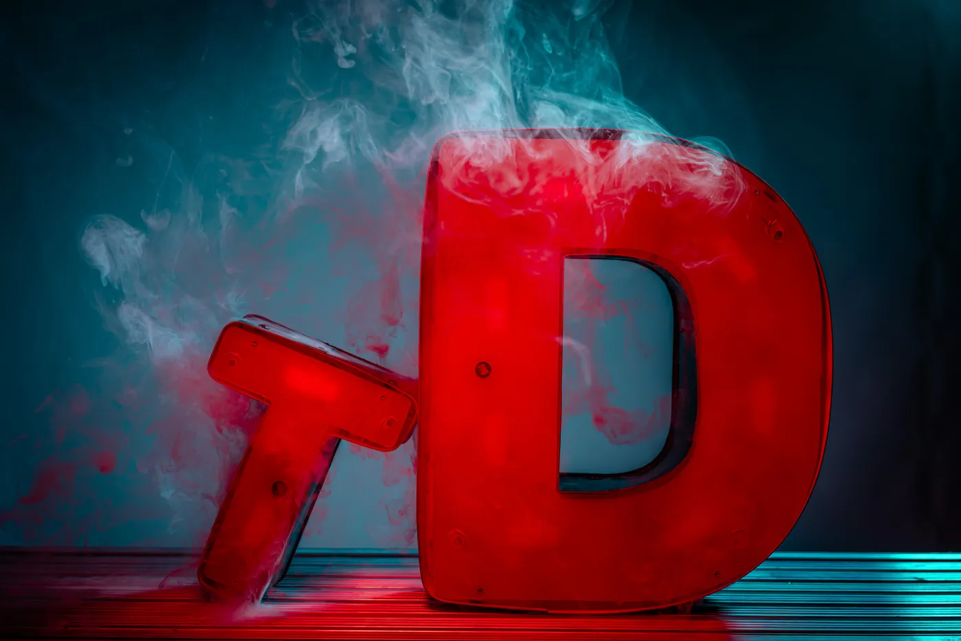 Throttle Down — the TD letters lit red in teal smoke